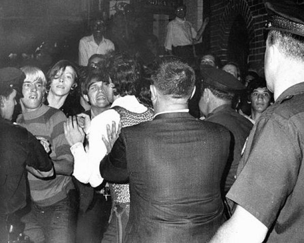 Image: Police push protestors back outside of the Stonewall Inn in the early hours of June 28, 1969. From the Wikimedia Commons.