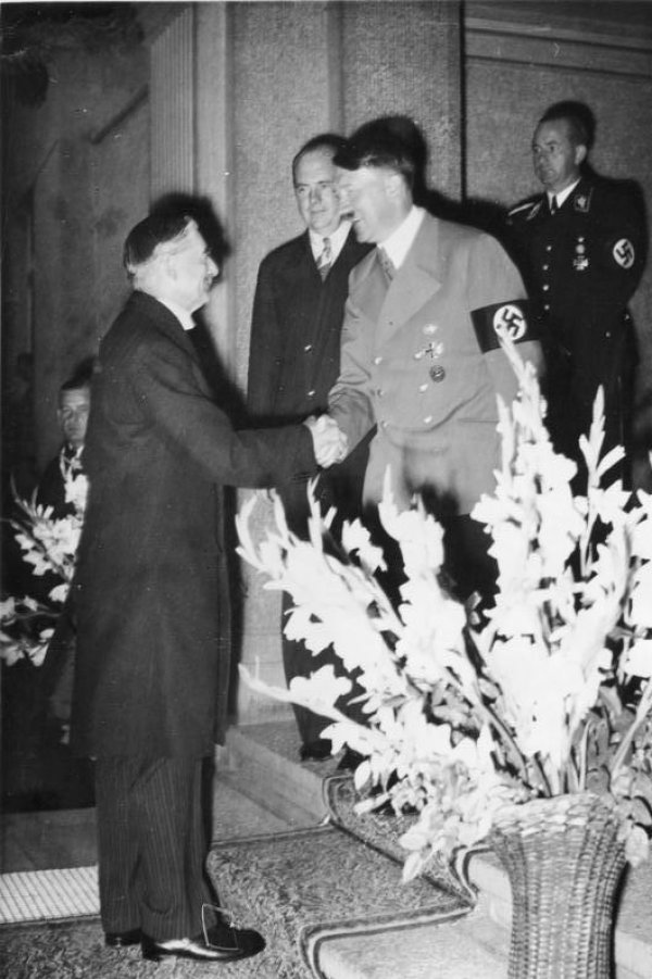 Image: Photo of Neville Chamberlain and Adolf Hitler at the Munich Agreement in 1938. From the Wikimedia Commons.