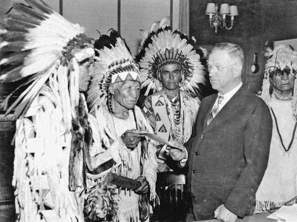 Image: Photo of Secretary of Interior Harold Ickes and delegates of the Confederated Tribes of the Flathead Indian Reservation in 1935.