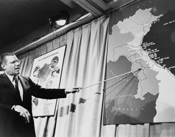 Image: Photo of Secretary of Defense McNamara at a press conference taken by Marion S. Trikosko, 1965. From the Library of Congress.