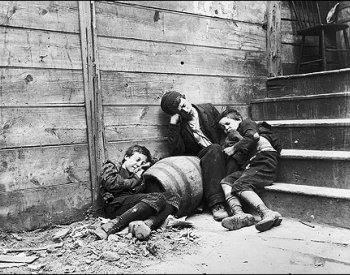 Image: Photo of street children in "sleeping quarters" taken by Jacob Riis in 1890. From the Library of Congress.