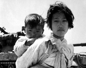Image: Photo of a Girl and her brother during the Korean War by Maj. R.V. Spencer, 1951. From the Flickr Commons.