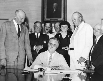 Image: Photo of President Roosevelt Signing the 1935 Social Security Act. From the Wikimedia Commons.